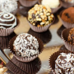 Different types of Milk chocolate truffles on a silver serving tray