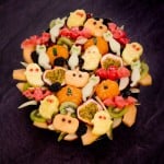 Halloween Fruit Salad with shapes of cats, pumpkin,ghost and bats with edible eyes