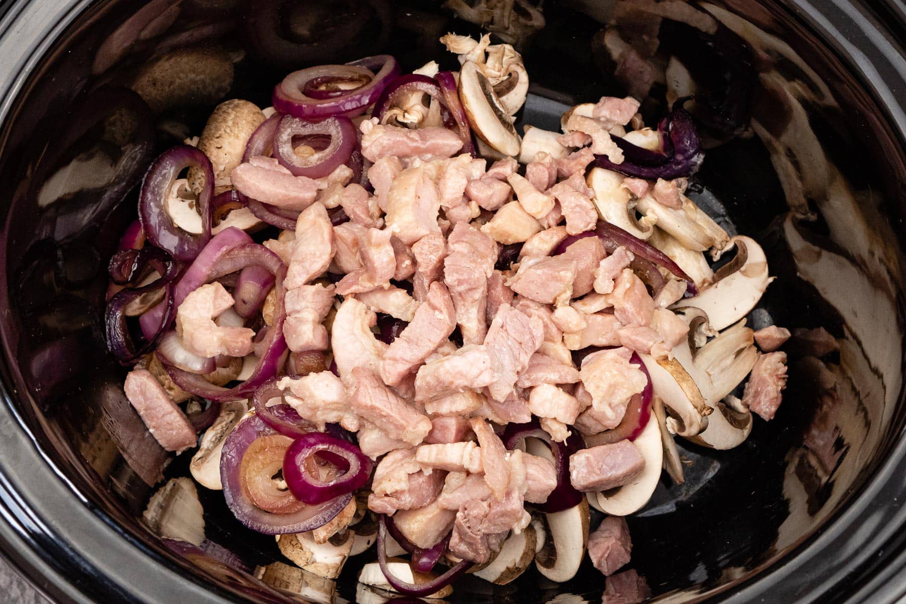 slow-cooker-sausage-casserole-with-onion-and-mushrooms