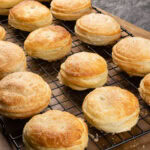 Puff Pastry Mince Pies cooling off on a black wire rack
