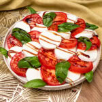 Tomato and Mozzarella Salad drizzled with balsamic glaze and olive oil