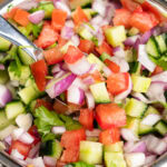 Indian Onion Salad being picked up with a spoon