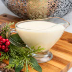 Christmas pudding sauce in a glass jug