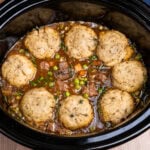 Slow Cooker Beef Stew with eight Dumplings on top