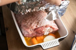 Covering the turkey thigh in a oven proof dish with foil