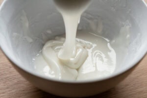 Icing being mixed in a bowl