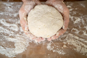 Suet dough formed and a ball in hands