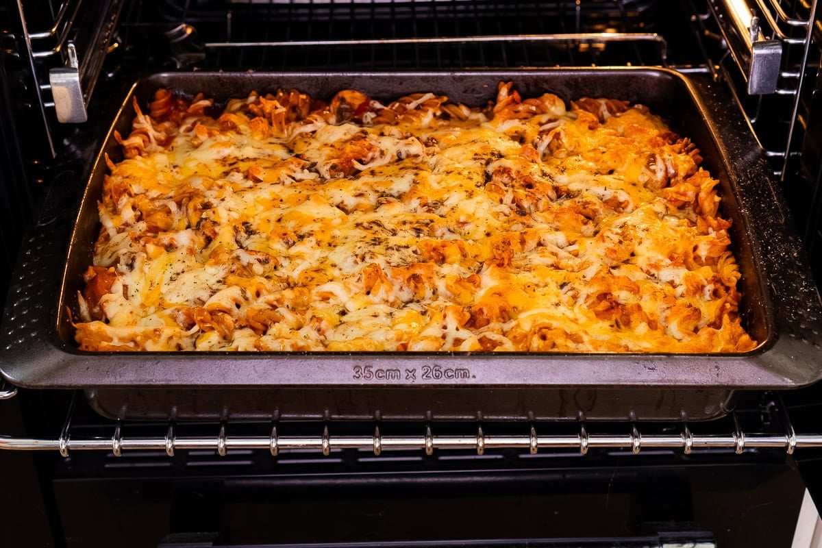 Cheesy Sausage Pasta Bake coming out of the oven