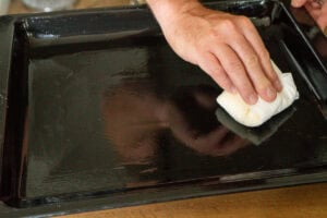 greasing tray before roasting