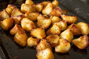 Crisp and golden roast potatoes cooked in beef cooking juice