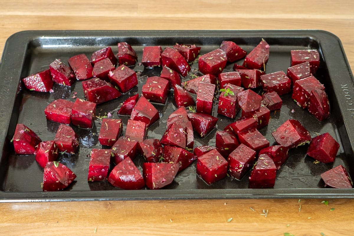 Beetroot cubes on baking tray ready for cooking.